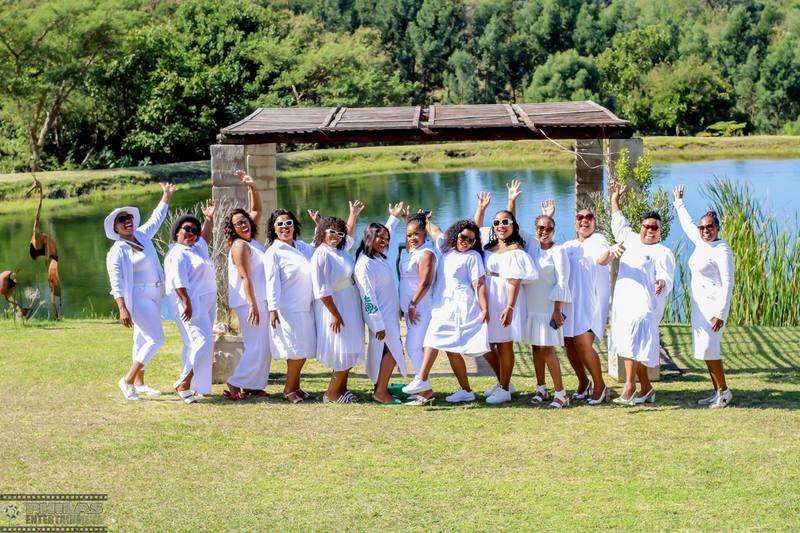 White dress group by lake